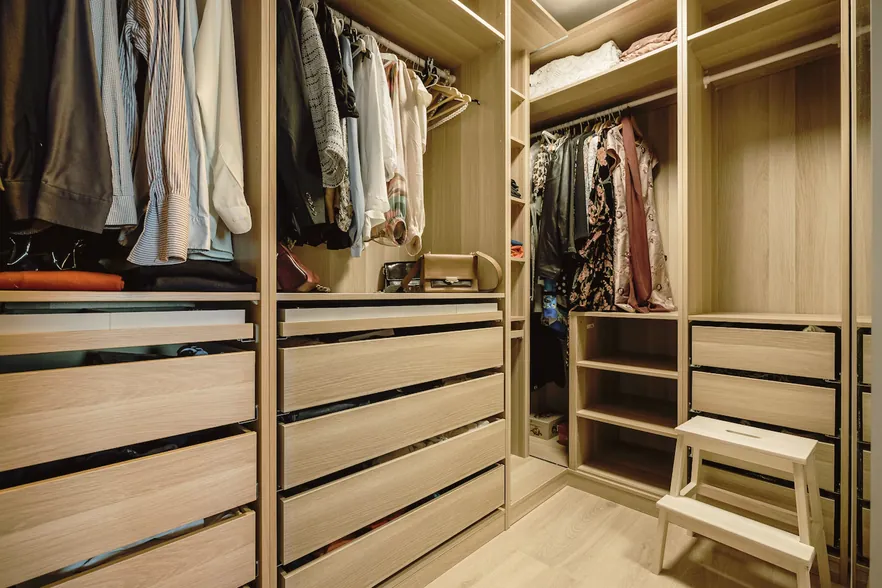 Bedroom with wall-mounted TV unit and wardrobe